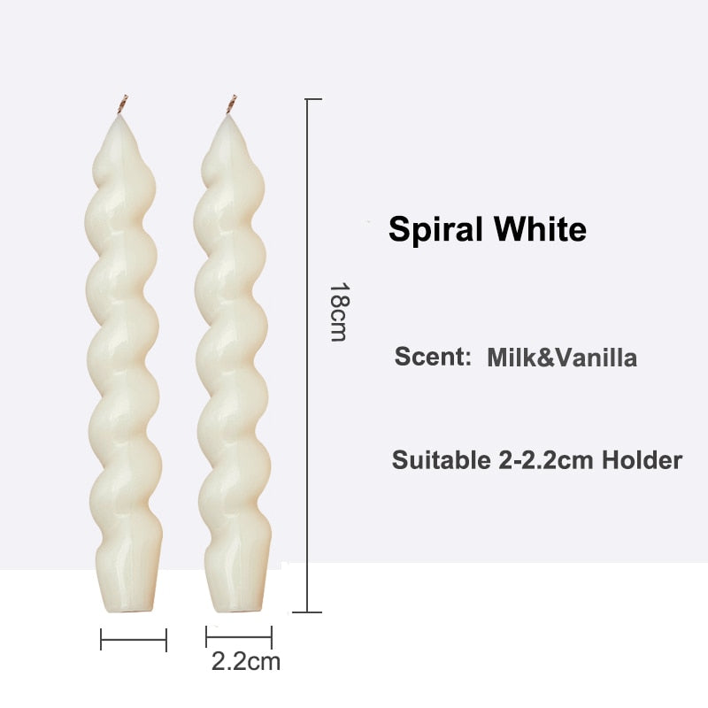 Decorative Pair of Twisted Pillar Candles with a rich hue of white, showcasing intricate design.