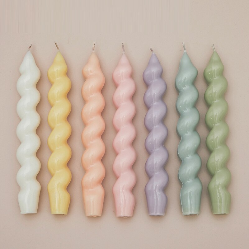 Vibrant assortment of tapered candles in various hues, adding a pop of colour to any setting.