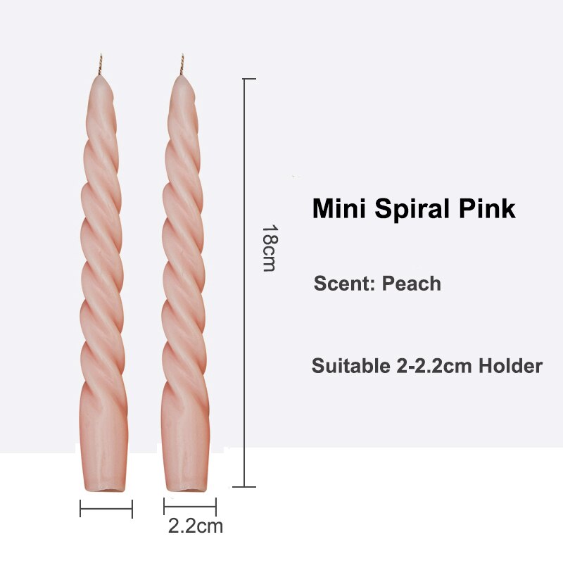 Decorative Pair of Twisted Pillar Candles with a rich hue of pink, showcasing intricate design.