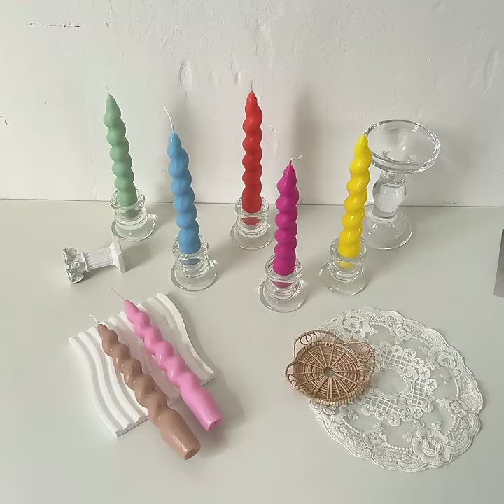 Relaxing video displaying an Vibrant assortment of tapered candles in various hues, adding a pop of colour to any setting.